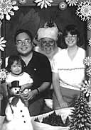 [ Katie and Family with Santa ]