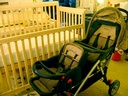 [ The Berry crib and our overpriced tandem stroller. ]